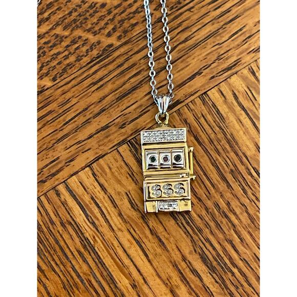 Costume jewelry gambling charm gold town, and silver tone necklace - Picture 2 of 4